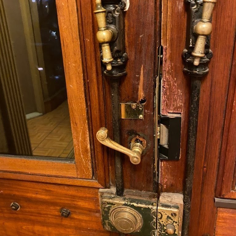 Antique brass bolts, lever and lock on a pair of wood doors, Metro Local Locksmith