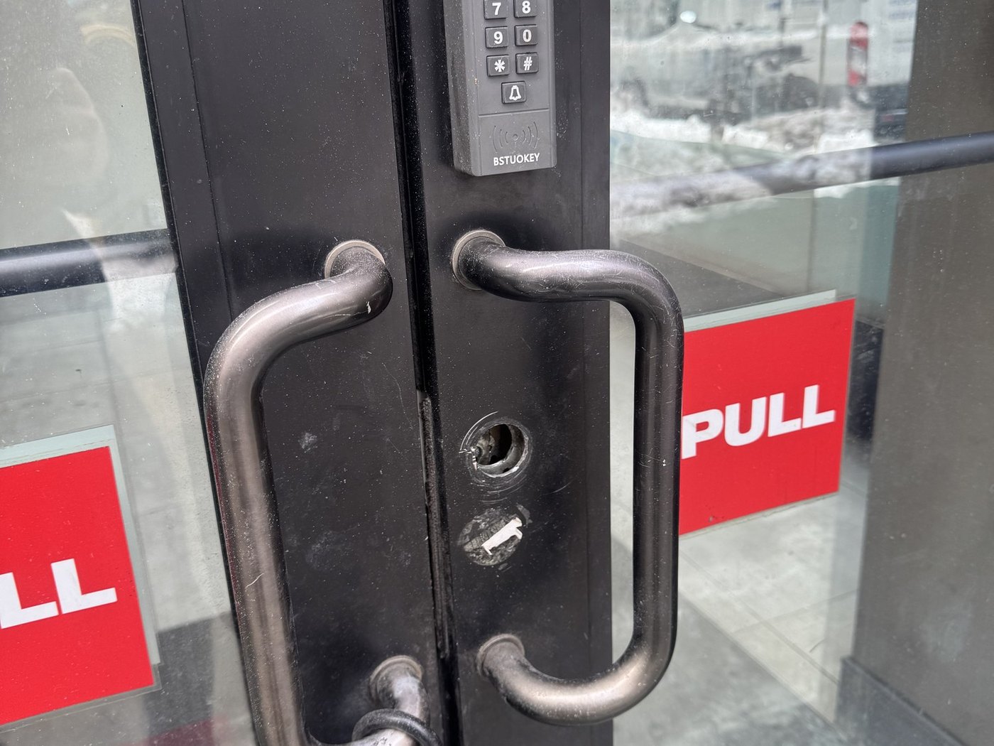 Keypad lock and pull handles on a commercial glass door, Metro Local Locksmith