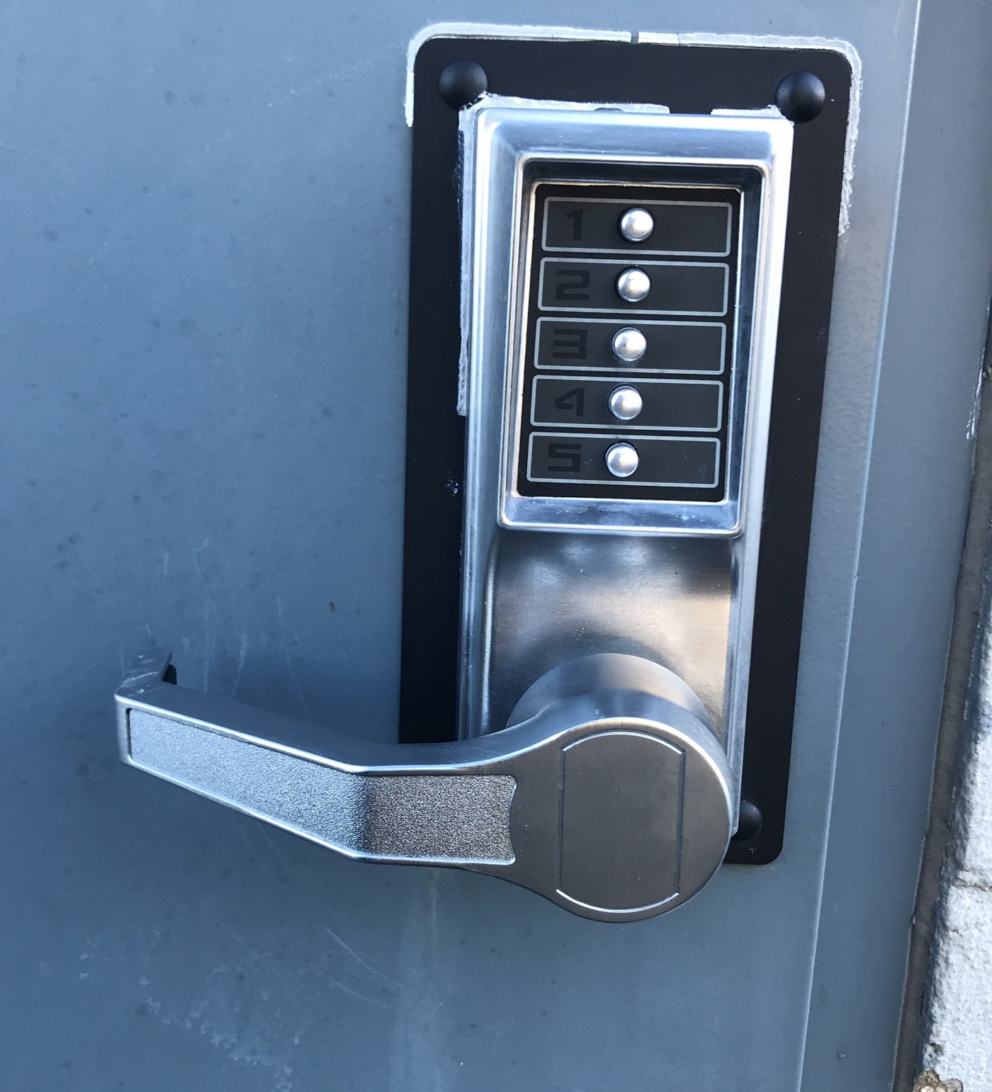 Commercial pushbutton keypad lock - Metro Local Locksmith Pushbutton keypad lever lock on a commercial steel door, installed by Metro Local Locksmith of the Upper East Side, Manhattan