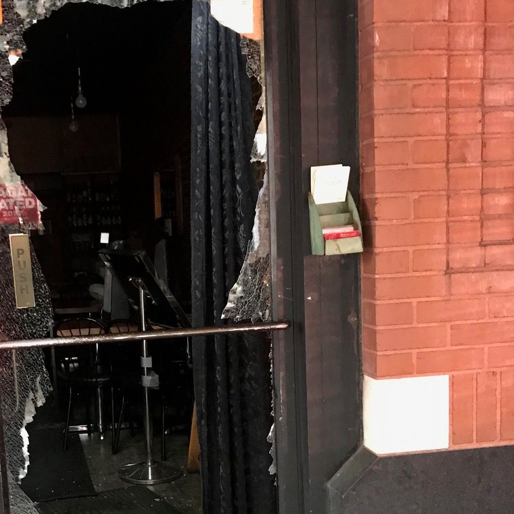 Broken glass storefront door needing emergency locksmith and door repair, Metro Local Locksmith