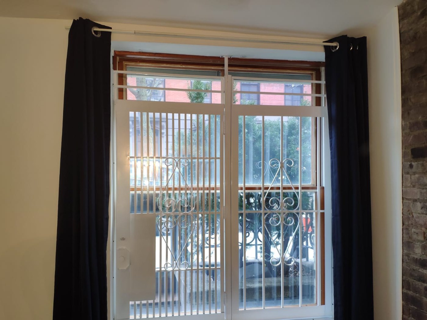 Residential window security gate inside an apartment, Metro Local Locksmith