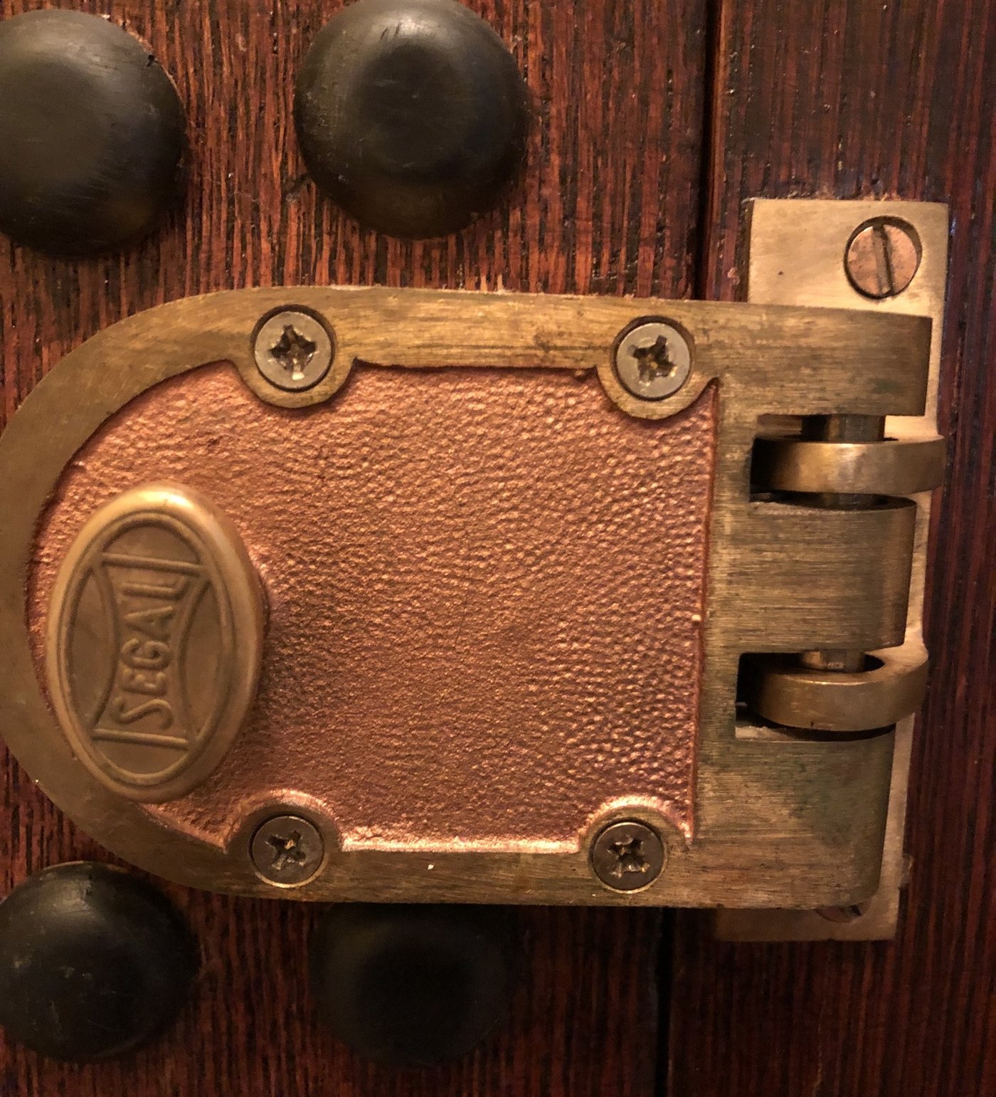 Rim deadbolt with a vertical bolt on a wood apartment door, installed by Metro Local Locksmith, NYC