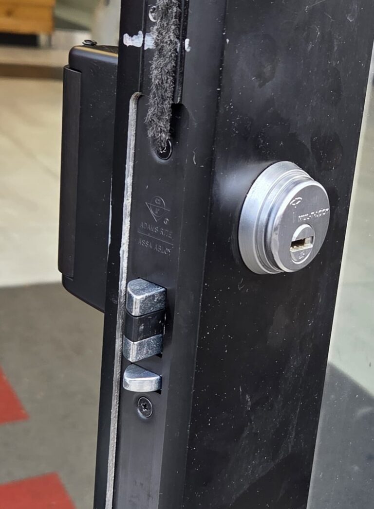 Mul-T-Lock high-security cylinder installed on a commercial aluminum glass door, Bronx, NYC