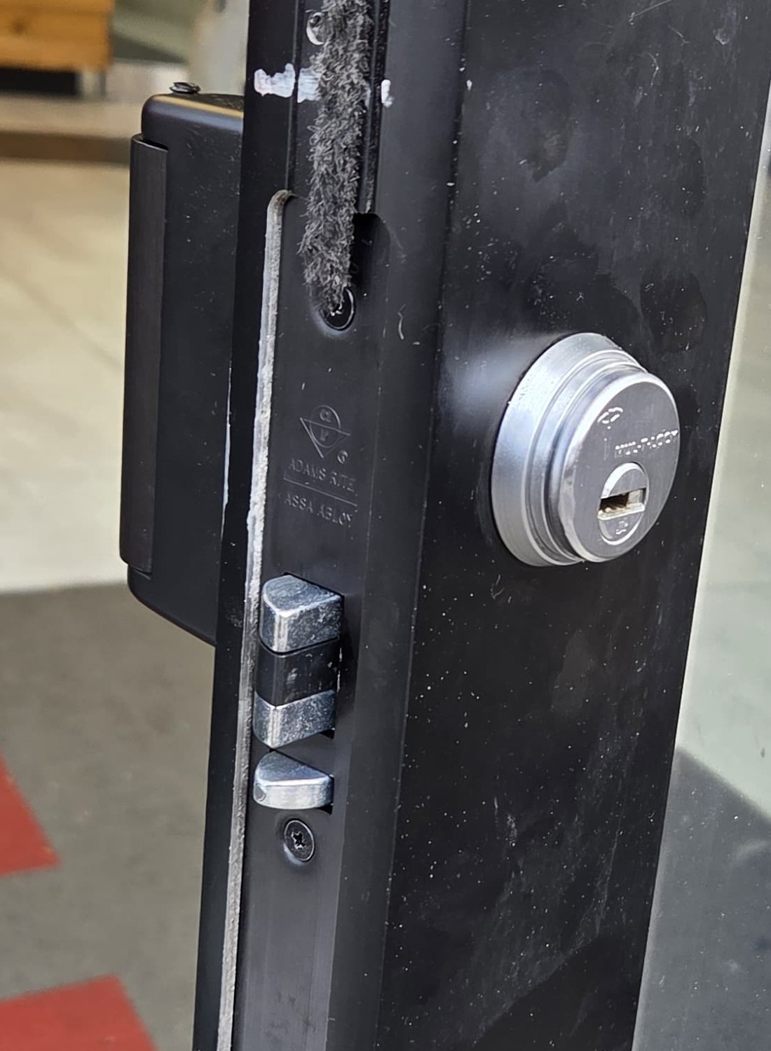 Mul-T-Lock high-security cylinder installed on a commercial aluminum glass door, Bronx, NYC